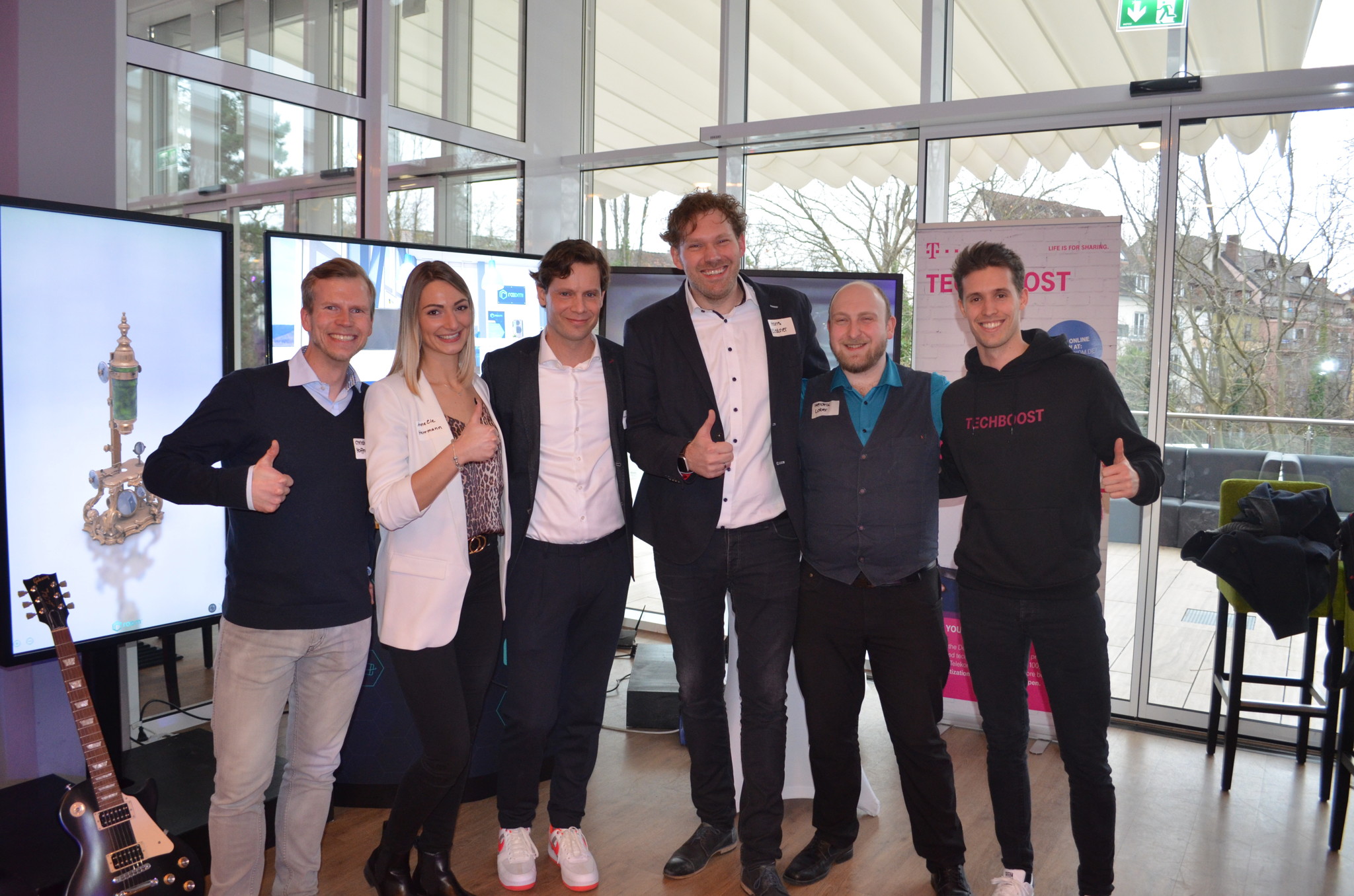 Employees of rooom together with representatives of Telekom after the victory Victory photo after the award as Startup Winner